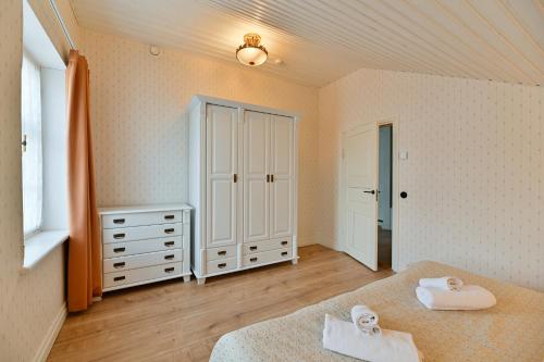 Postel nebo postele na pokoji v ubytování Pargimaja Apartments