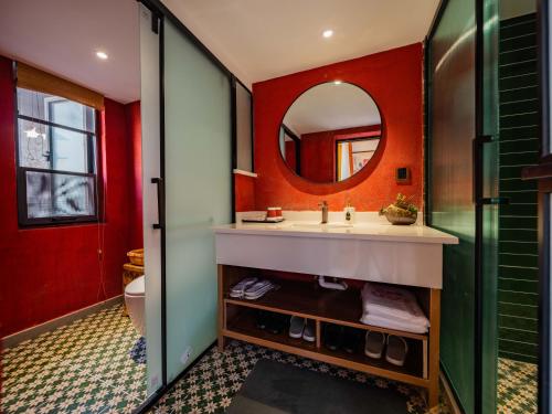 a bathroom with a sink and a mirror at Joke Inn in Xi'an