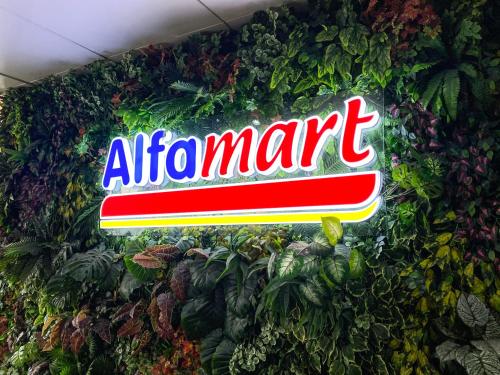 a sign for an air appliance store with plants at Studio Condo Manila by the Bay Roxas Blvd near US Embassy in Manila
