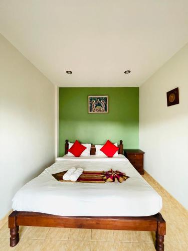 Ένα ή περισσότερα κρεβάτια σε δωμάτιο στο Meewaya Hotel