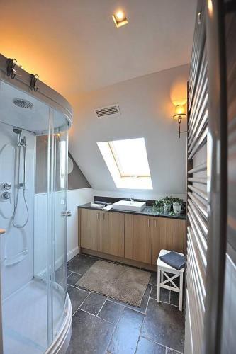a bathroom with a shower and a sink at Villa71 in Rijkevorsel