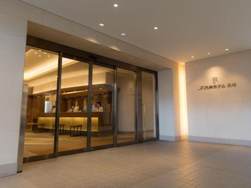an entrance to a building with glass doors at JR Kyushu Hotel Nagasaki in Nagasaki