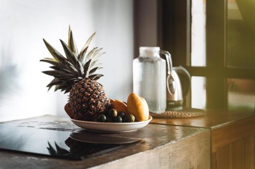 a bowl of fruit on top of a counter at ANITSA RESORT in El Nido