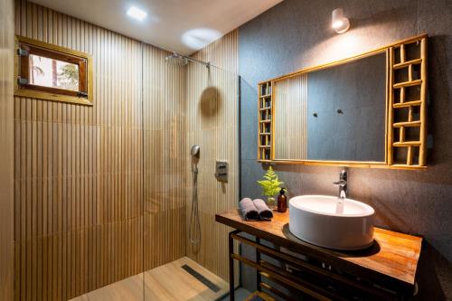 a bathroom with a sink and a shower at ANITSA RESORT in El Nido