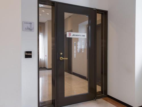 a door with a sign that reads rx amazon at JR Kyushu Hotel Nagasaki in Nagasaki