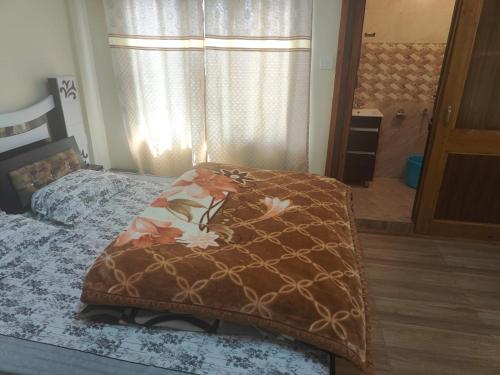 מיטה או מיטות בחדר ב-Conifers Homestay