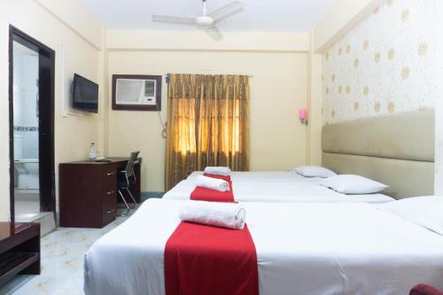 Postel nebo postele na pokoji v ubytování Hotel Golden Inn Chattagram Ltd