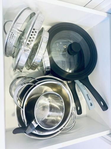 a group of kitchen utensils in a refrigerator at Nida family apartments in Nida