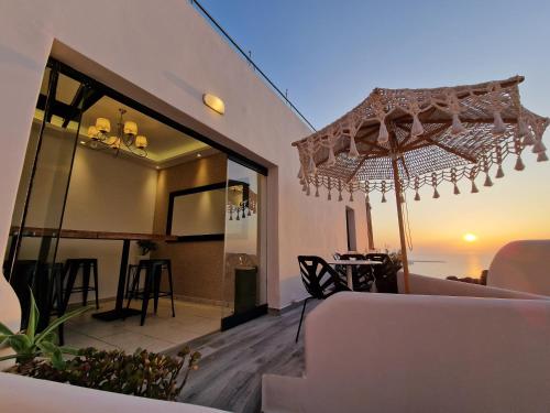 a living room with a view of the ocean at Galaxy Suites & Villas in Imerovigli
