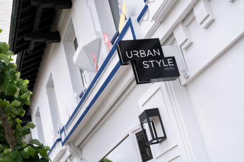 a sign that reads ubeam style on the side of a building at Urban Style Biarritz Le Relais in Biarritz