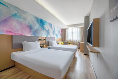 Krevet ili kreveti u jedinici u okviru objekta 星程西安钟楼回民街酒店