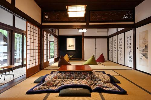 a room with a large bed in the middle of it at Casa Miyama in Nantan city