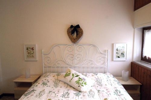Appartamento dei Laghi tesisinde bir odada yatak veya yataklar