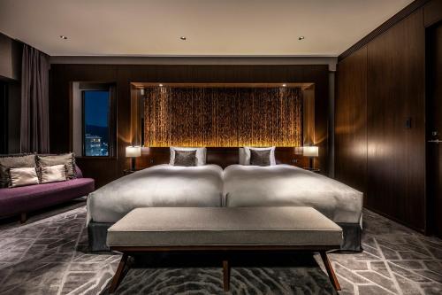 מיטה או מיטות בחדר ב-The Royal Park Hotel Kyoto Sanjo