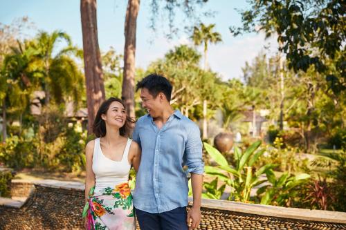a man and a woman standing next to each other at ROBINSON KHAO LAK in Khao Lak