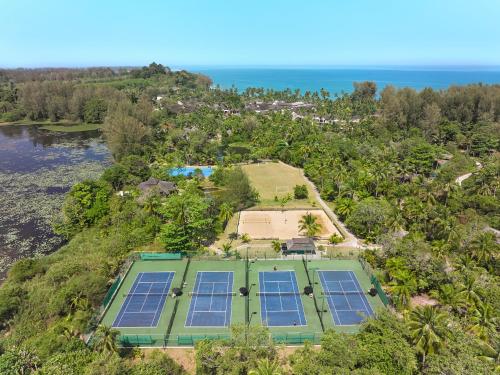an aerial view of a house with solar panels on the ground at ROBINSON KHAO LAK in Khao Lak