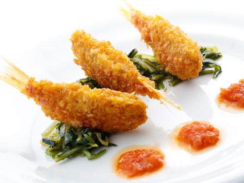 a white plate topped with three pieces of food at Ristorante Hotel Lucia - 100 mt dal mare in Giulianova