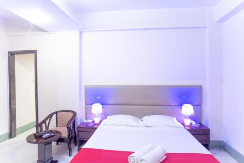 Postel nebo postele na pokoji v ubytování Hotel Golden Inn Chattagram Ltd