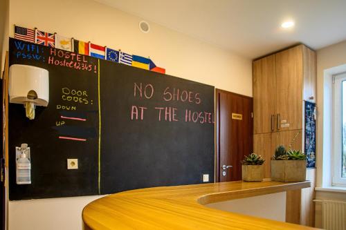 a room with a bed with no slippers at the hostel at Klaipeda Hostel in Klaipėda