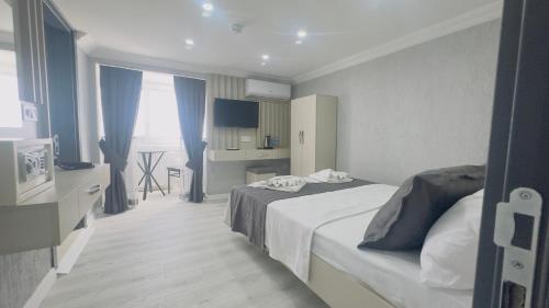 a hotel room with a bed and a kitchen at La Mer Old City Hotel in Istanbul