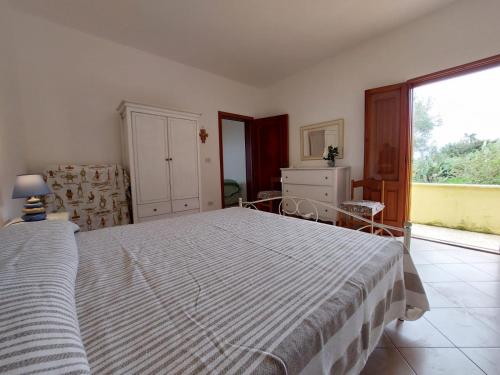 En eller flere senge i et værelse på Appartamento con vista mare