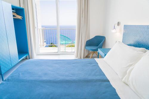 Ένα ή περισσότερα κρεβάτια σε δωμάτιο στο Hotel Orsa Maggiore