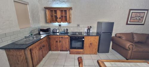 Kuchyň nebo kuchyňský kout v ubytování Bains Lodge