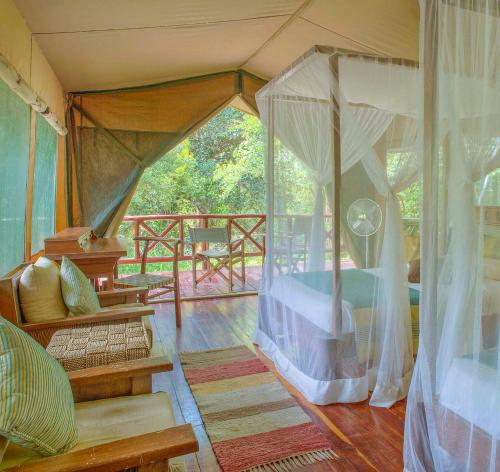 a bedroom with a bed in a tent at Mara Leisure Camp in Talek