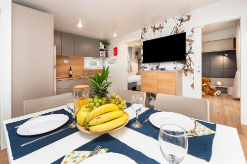 a dining room with a table with bananas on it at Glamping and Mobile Homes Lavanda - Holiday Centre Bi VIllage in Fažana