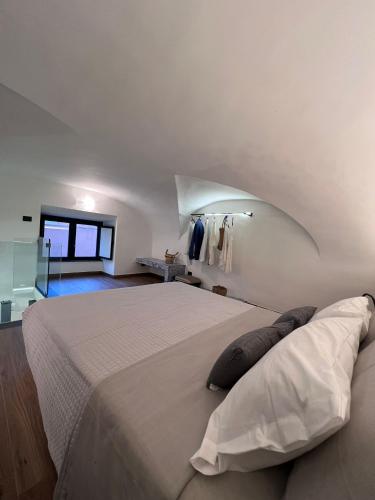 a bedroom with a large bed in a room at Vico37 Apartment in Acireale