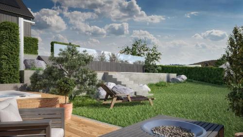 a backyard with a fire pit in the grass at Chalet Young & Fun in Freyung