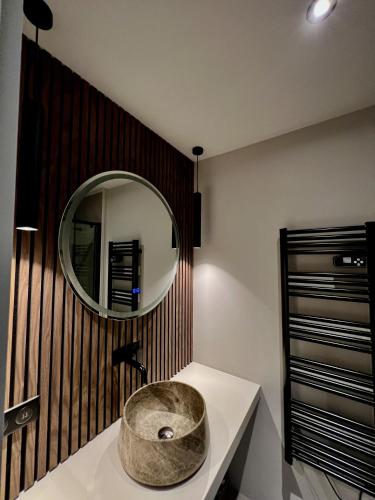 a bathroom with a sink and a mirror at Casa iKa Port Grimaud - Maison 4 chambres + amarrage in Grimaud
