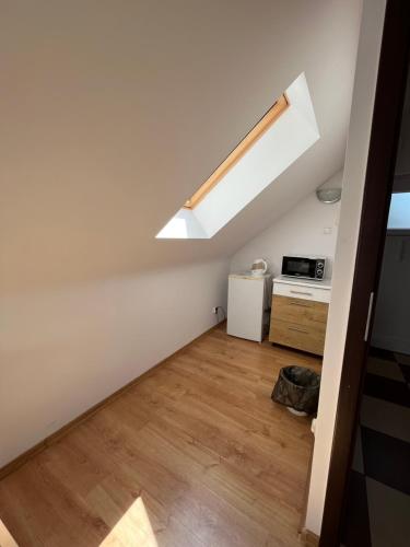 an attic conversion of a house with a skylight at Ośrodek Wypoczynkowy AKWA Marina in Nysa