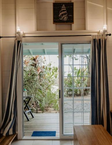 an open door in a room with a porch at CherryTree Bungalow of Villa Paraiso / Beachfront in Big Creek