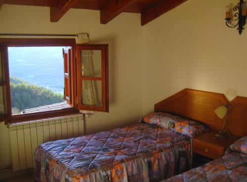 Cama o camas de una habitación en Casa Enriu-Alojamiento y desayuno