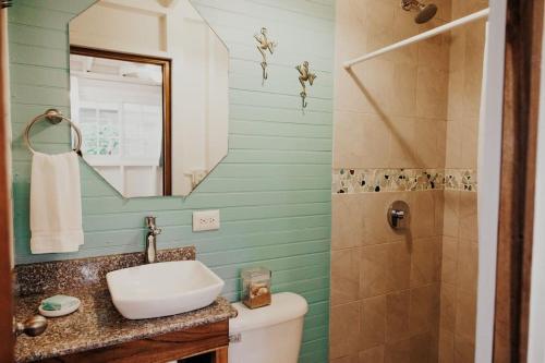 a bathroom with a sink and a shower at CoconutTree Bungalow of Villa Paraiso / Beachfront in Big Creek