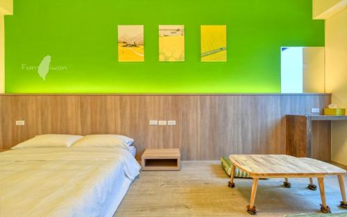Postel nebo postele na pokoji v ubytování 漫活時光民宿 Leisure Living