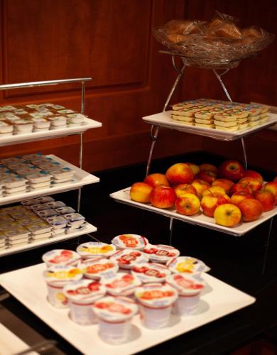 a display of different types of food on trays at Hotel Milano in Rotterdam