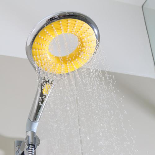 a shower head with water coming out of it at Bloom Hotel - HSR Club in Bengaluru