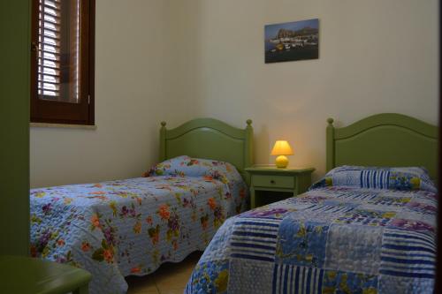 Postel nebo postele na pokoji v ubytování Vacanze Morfino