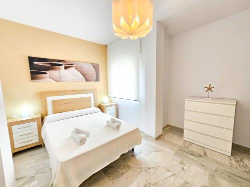 Postel nebo postele na pokoji v ubytování Yeti Ático Beach - Alojamientos La Torre