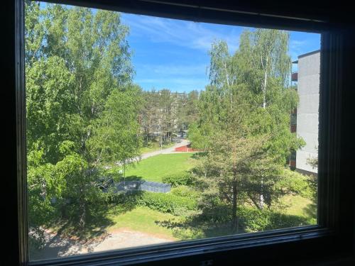a view from a window of a park at Cozy apartment in Parainen 