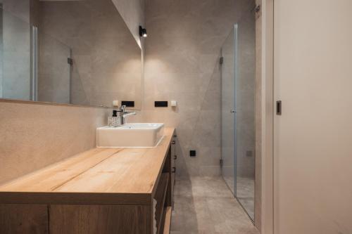 a bathroom with a sink and a shower at Apartmani Stipe Brela in Brela