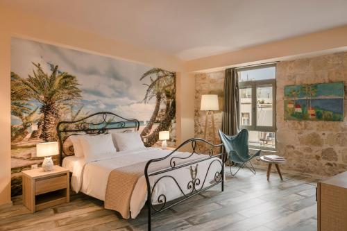 una camera da letto con un letto e un dipinto sul muro di Fileas Art Hotel a Chania
