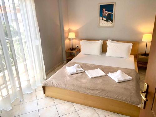 Postel nebo postele na pokoji v ubytování MIna Apartments 2 Nea Kallikrateia