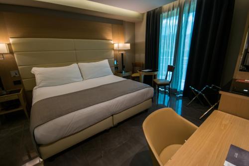 Letto o letti in una camera di Hotel Forum