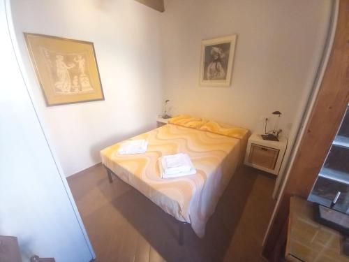 Postel nebo postele na pokoji v ubytování BIANCOFIORE Alloggio Turistico