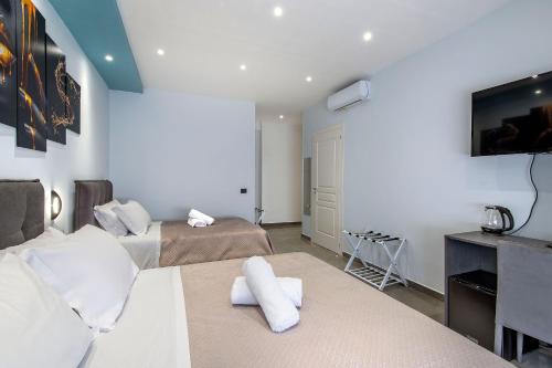 Ένα ή περισσότερα κρεβάτια σε δωμάτιο στο Garibaldi Rooms