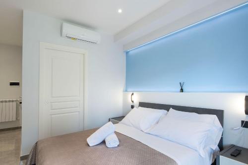 Ένα ή περισσότερα κρεβάτια σε δωμάτιο στο Garibaldi Rooms