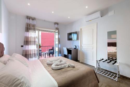 Ένα ή περισσότερα κρεβάτια σε δωμάτιο στο Garibaldi Rooms